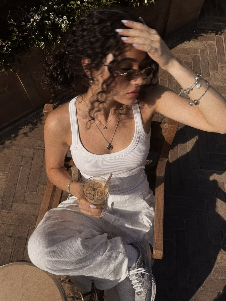 Girl Sitting On Chair In Cafe Iced Coffee Motion Blur