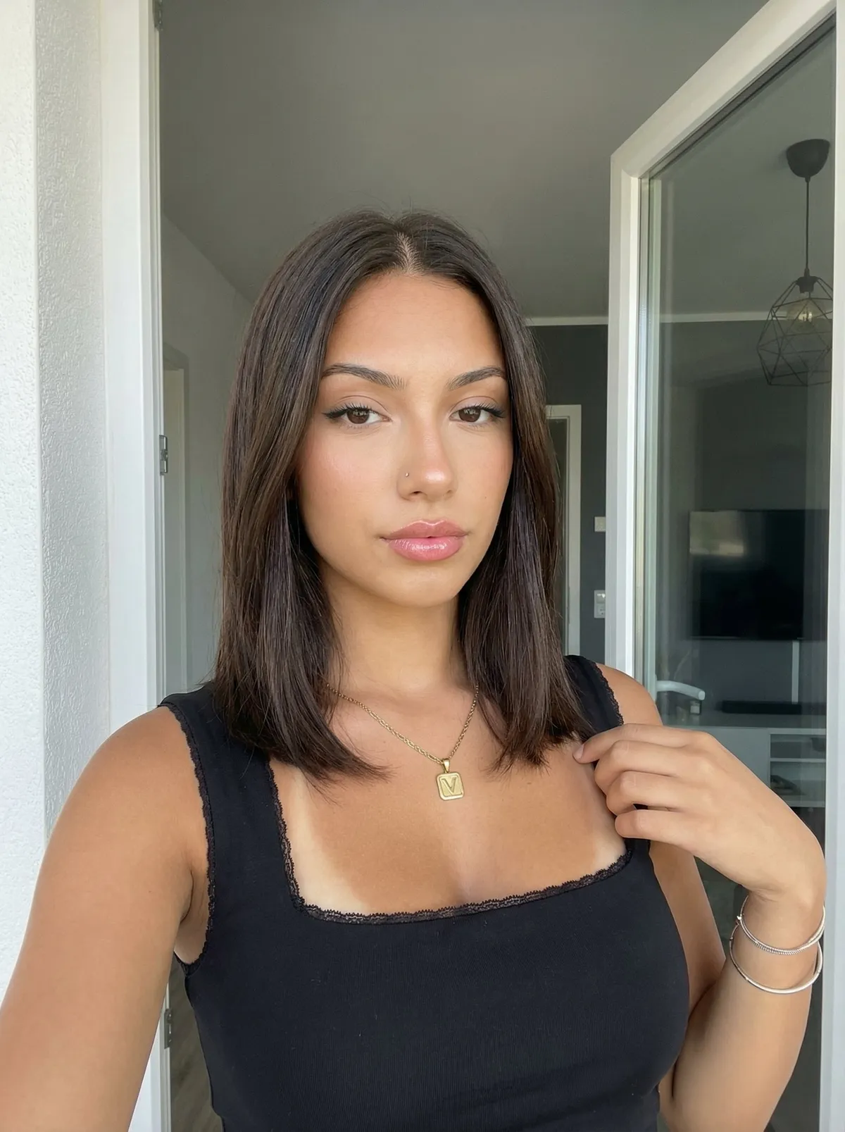 Necklace And Bracelets With Black Sleeveless Top