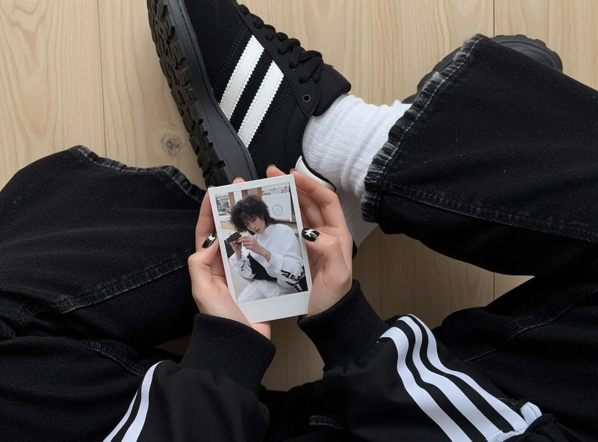 Acubi Holding Small Rectangular Instant Photograph Their