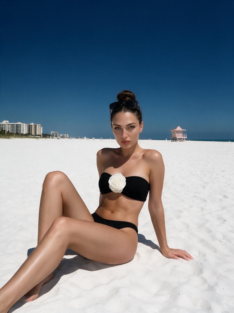 Black Bikini On White Sand Beach