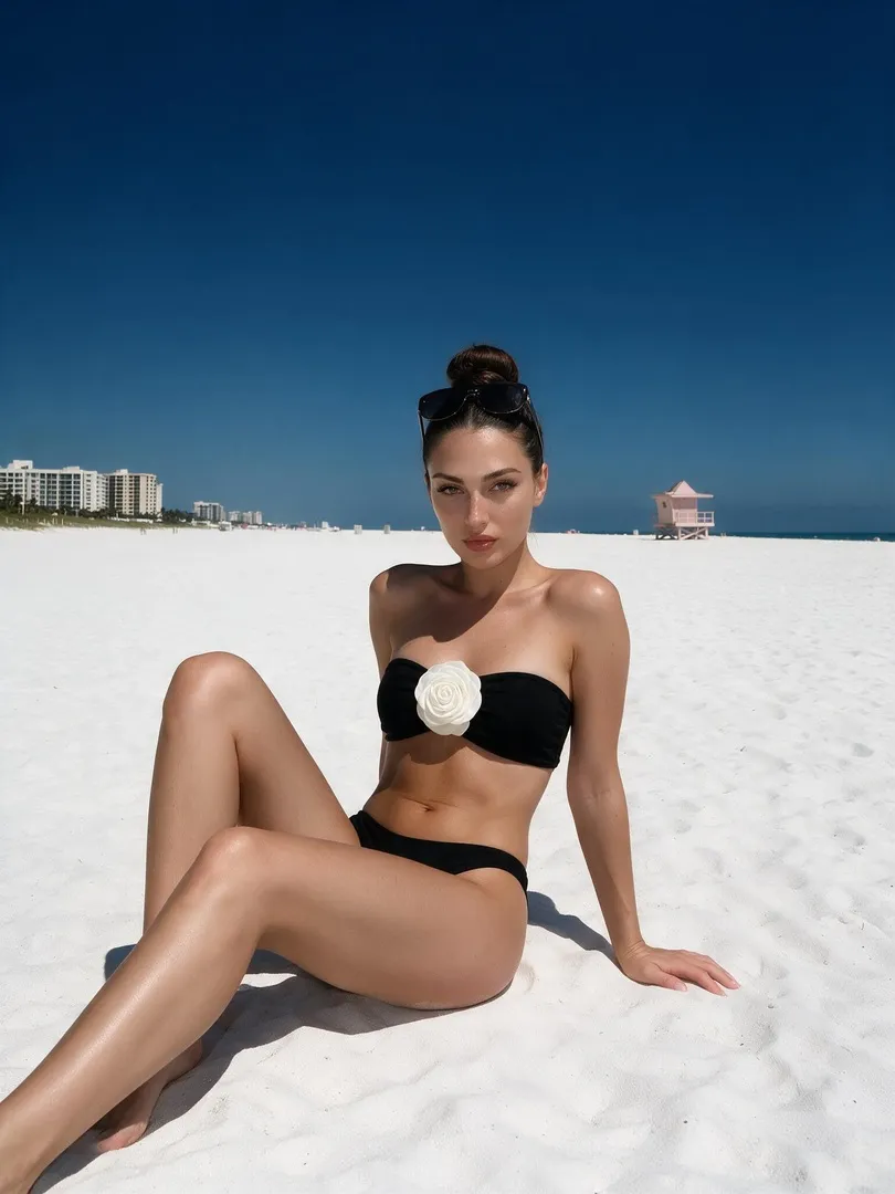 Black Bikini On White Sand Beach