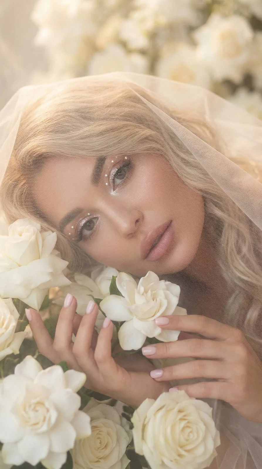 Makeup And Manicure With White Flowers And A Veil