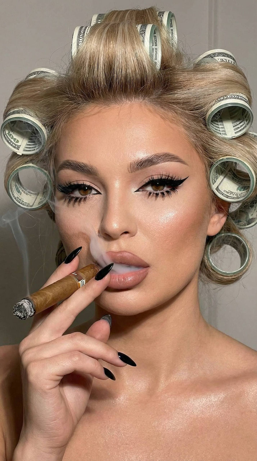 Close-up portrait of a woman with bold makeup and flash lighting, showcasing her confident pose and striking facial features.