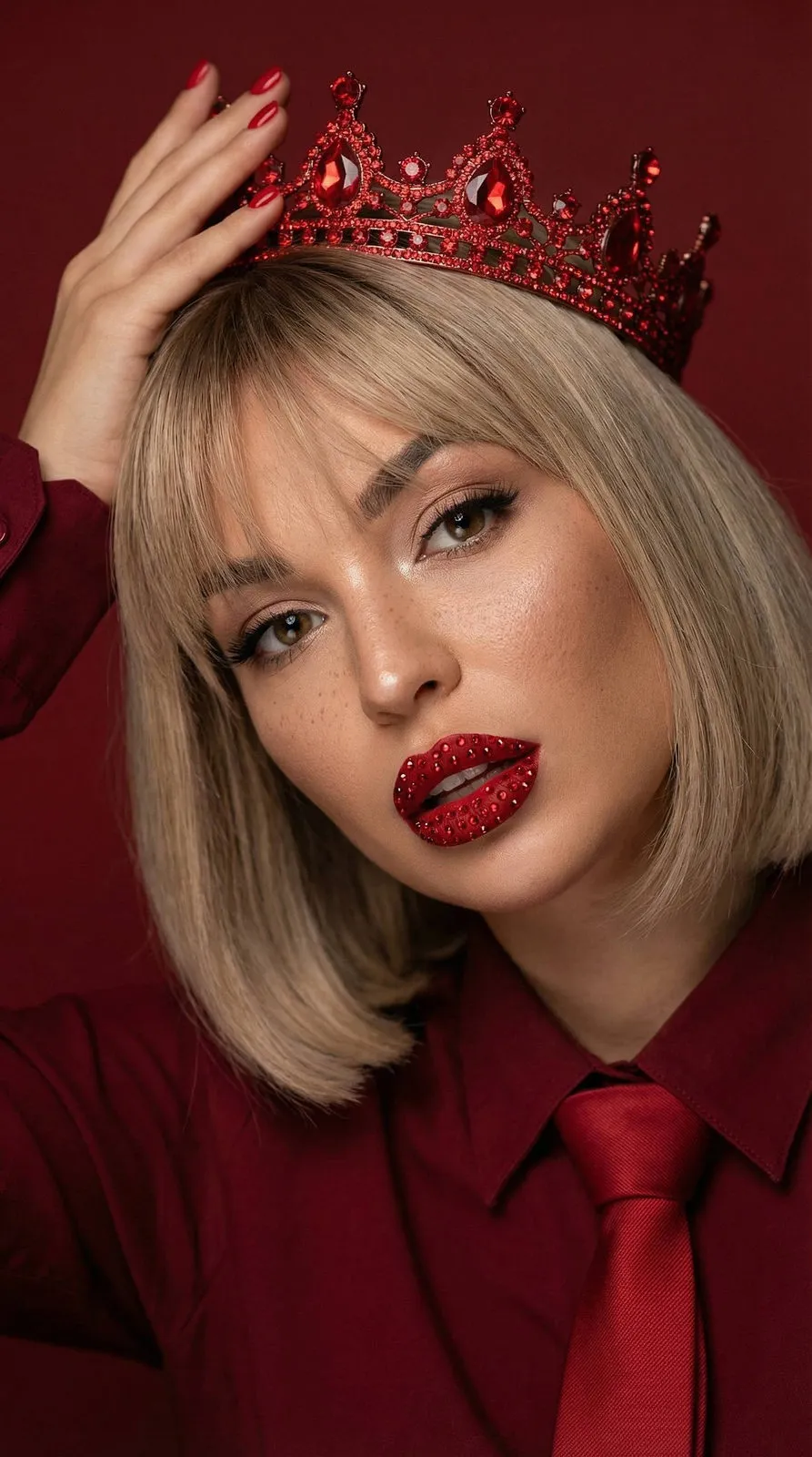 Makeup And Manicure In A Red Crown Portrait