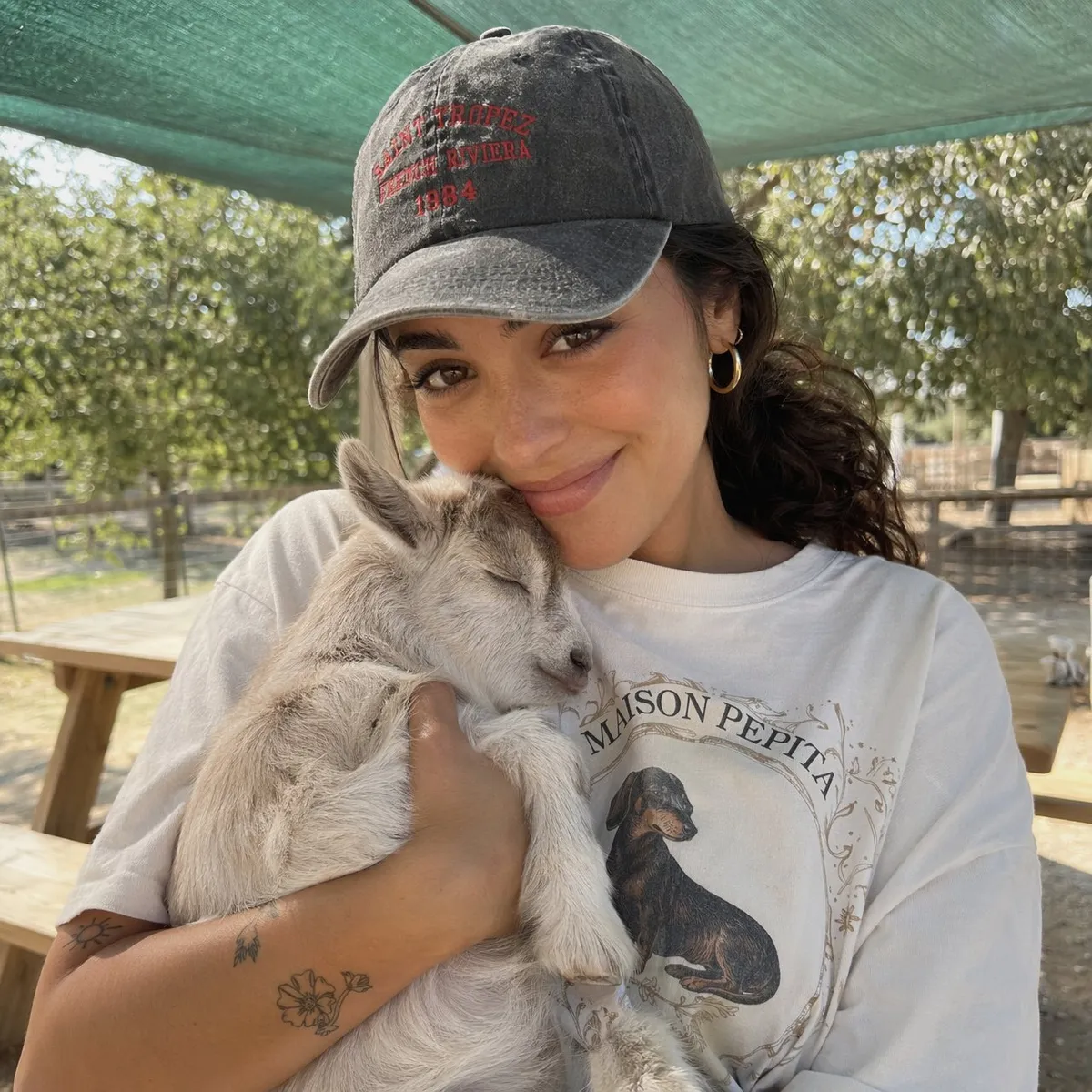 Holding Sleeping Baby Goat Outdoor Farm