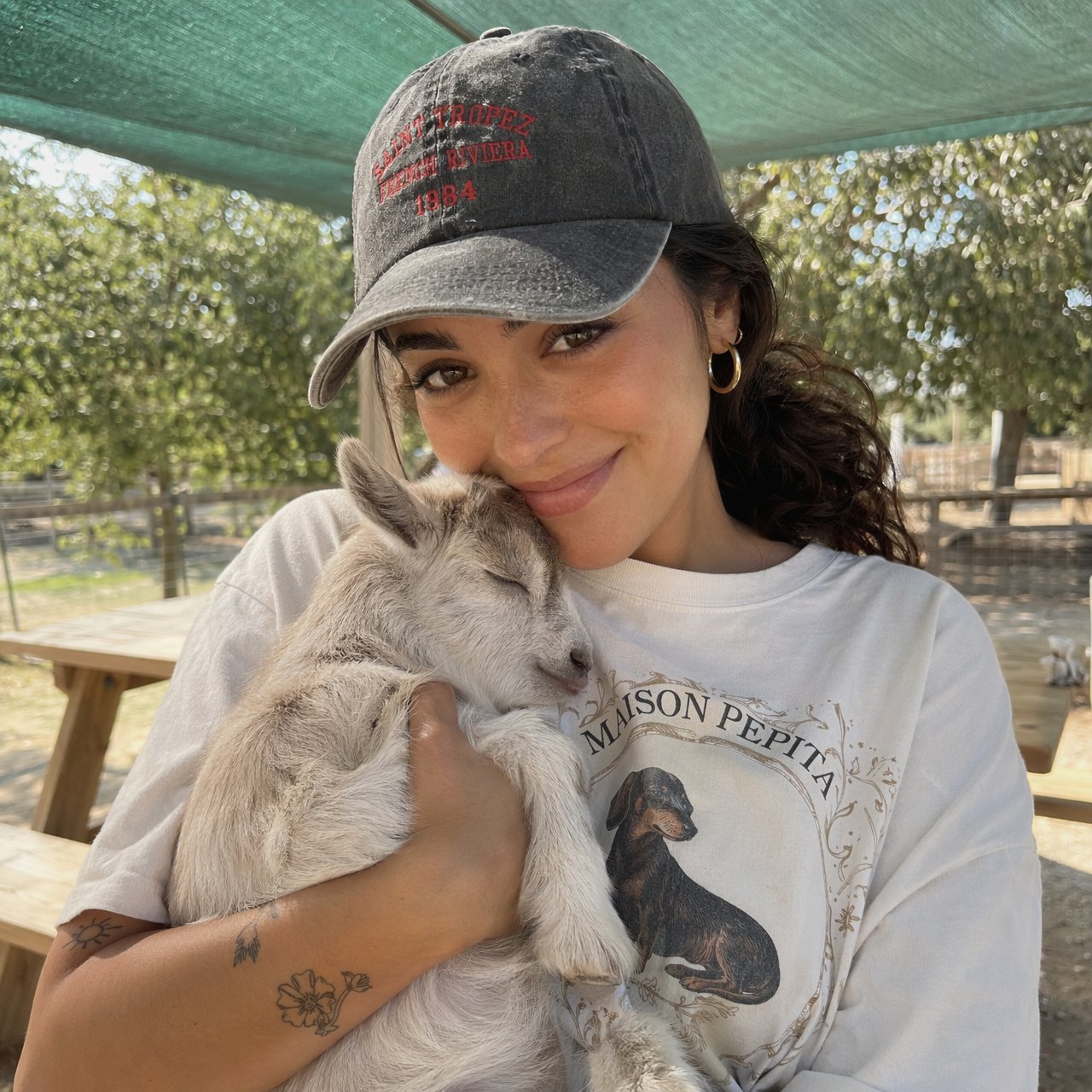 Holding Sleeping Baby Goat Outdoor Farm