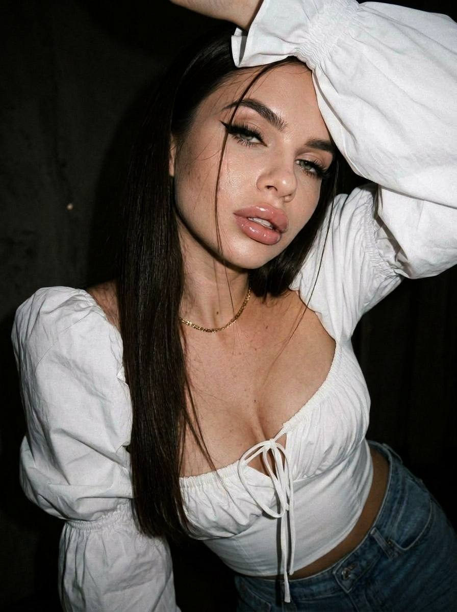 Girl With Eyeliner And Glossy Lips Low Angle