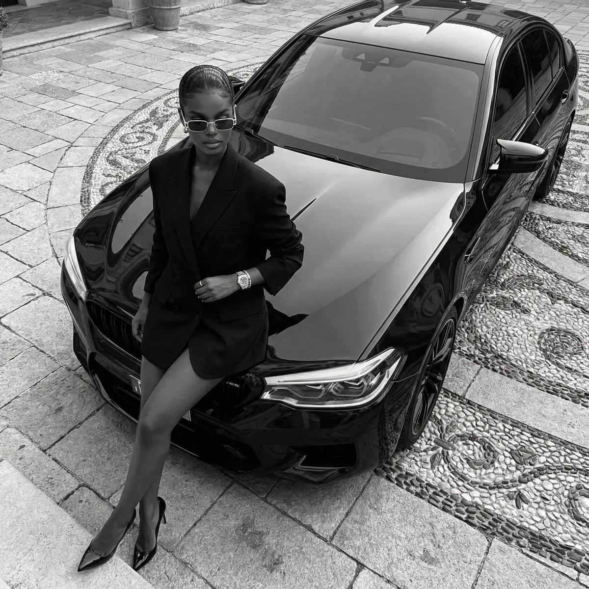 Sunglasses And Wristwatch In A High Angle Car Portrait