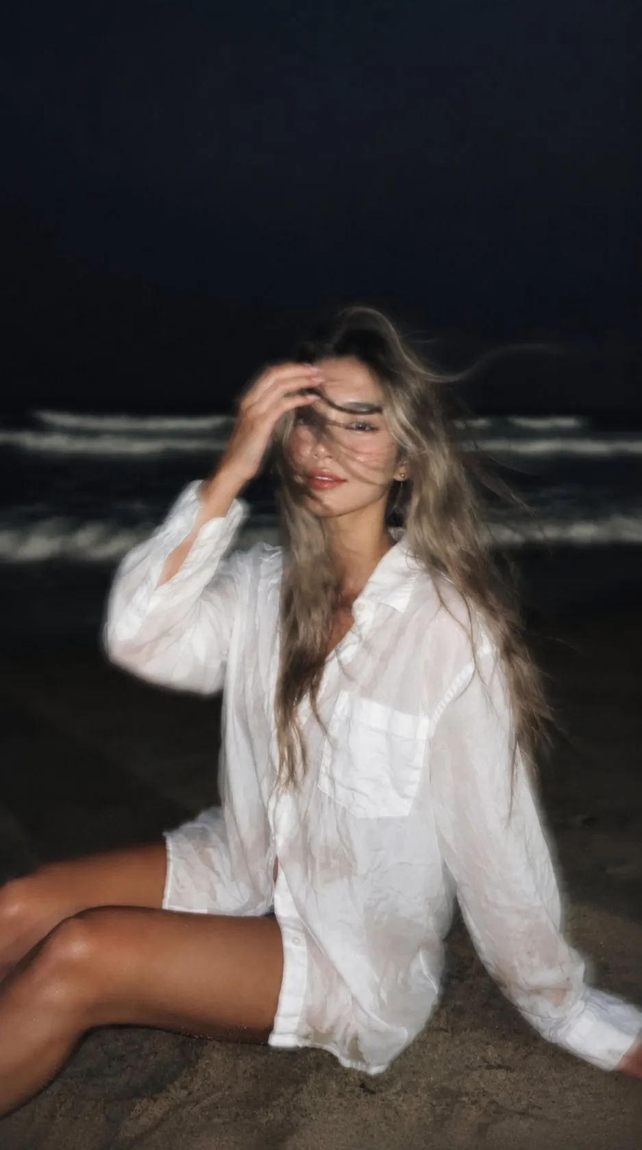 Loose In Dark Sand Near Shoreline