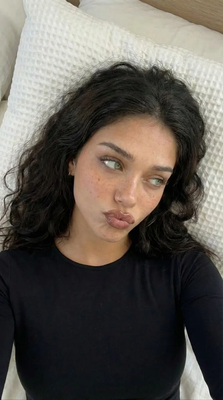 Black Top On Bed Soft Lighting