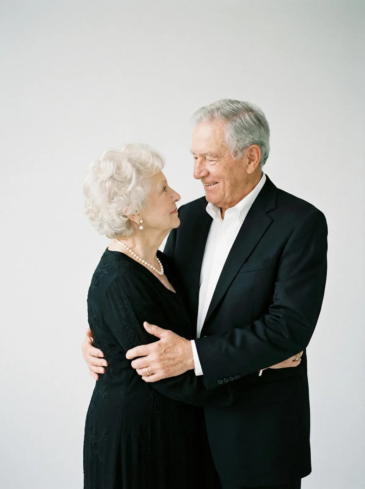 Elderly Couple Embrace