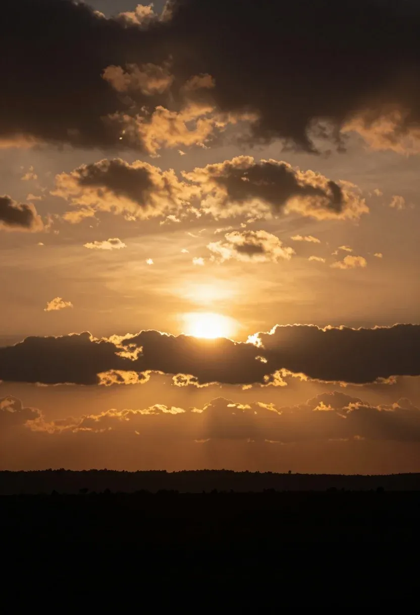 Dramatic Sunset Scene With Bright Sun Partially Obscured Dark Clouds