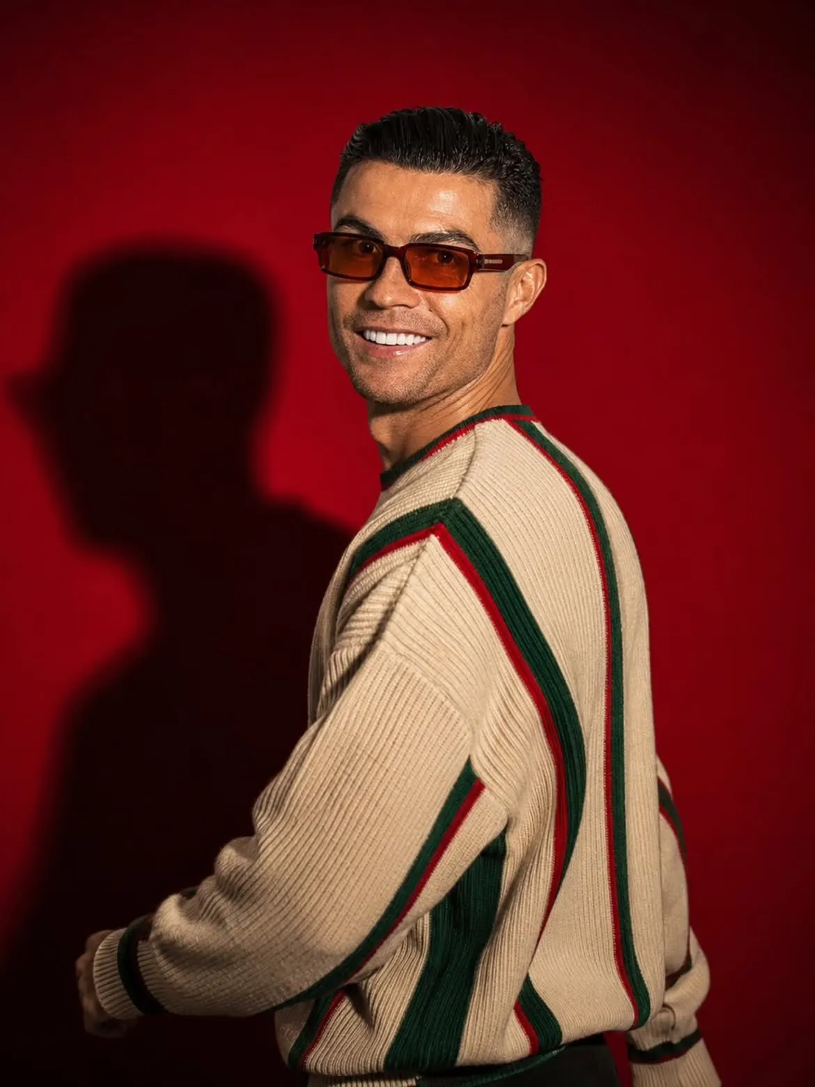 Striped Sweater With Shadow On Red Wall