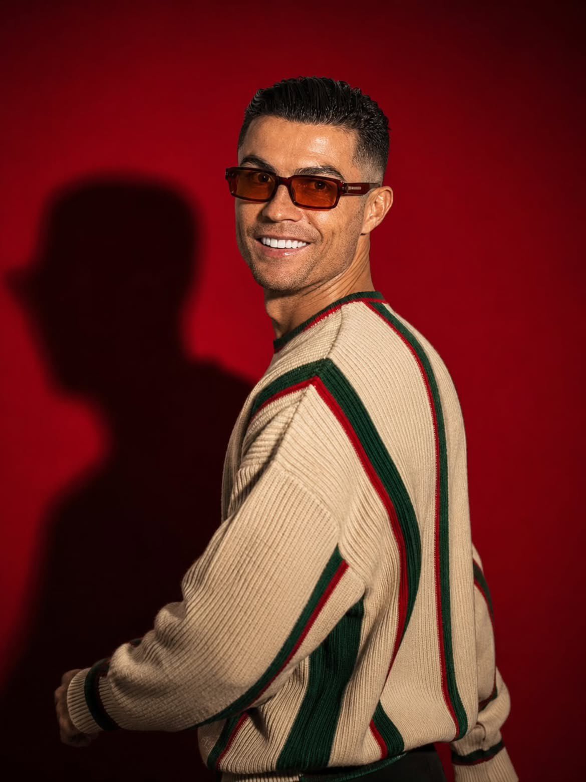 Striped Sweater With Shadow On Red Wall