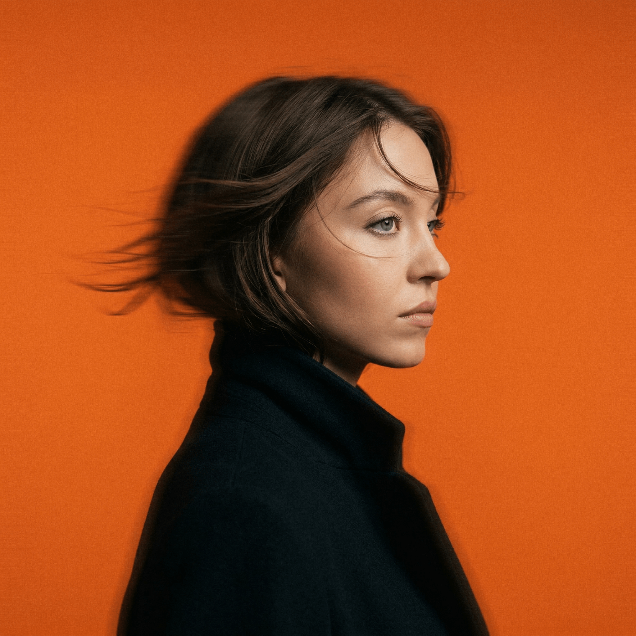 Mysterious Woman Side Profile Orange Studio Lighting