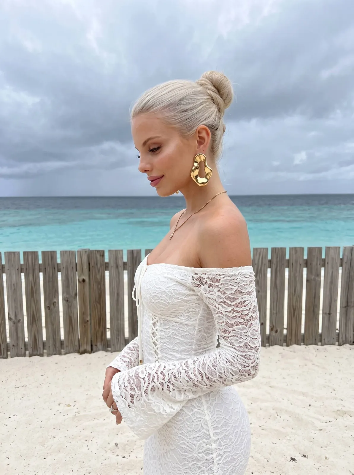 White Lace Dress On Sandy Beach