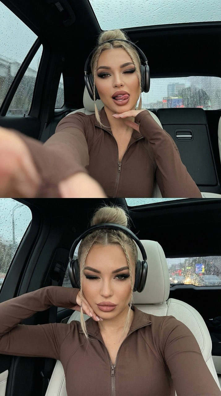 A girl taking a selfie in a car with a panoramic sunroof during rain, wearing a brown sports top and wireless headphones, seated on white leather.
