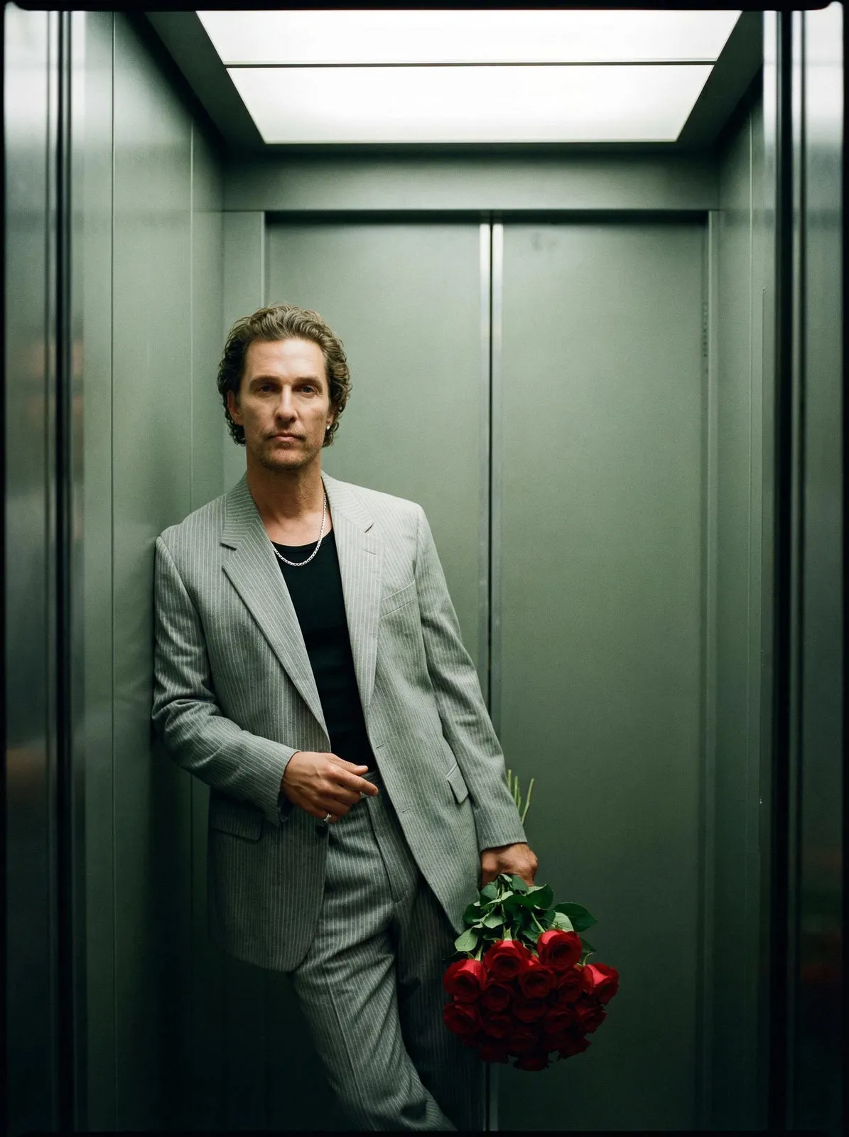 Elevator Portrait With Red Roses